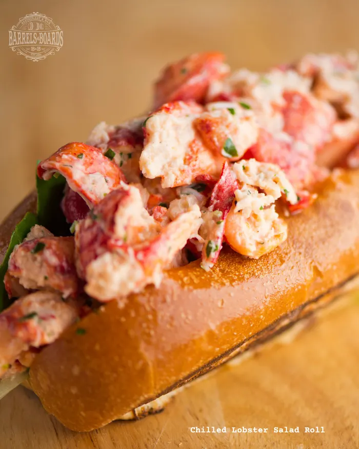 Chilled lobster salad roll on a toasted bun