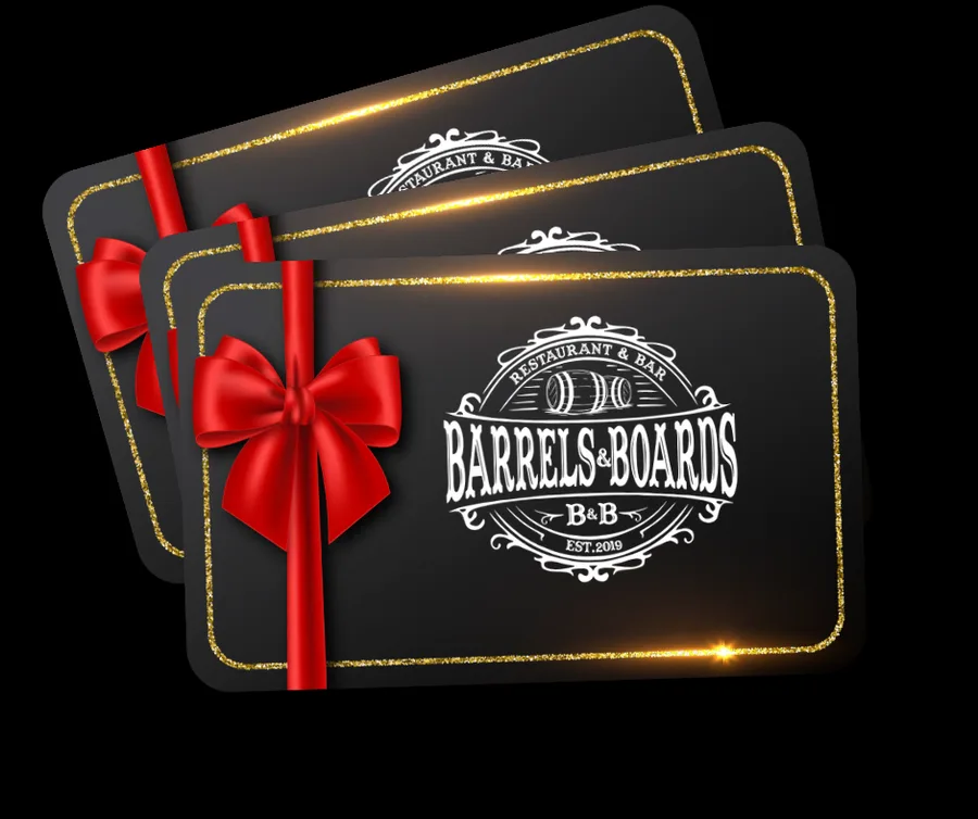 Three black and gold Barrels & Boards gift cards tied with red ribbons